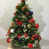Boxwood Christmas tree 15&quot; high and 10&quot; wide, adorned with ornaments and