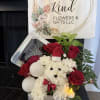 Celebrate the season with this adorable holiday floral arrangement featuring a handcrafted