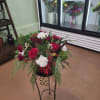 A festive blend of deep red and crisp white blooms accented with