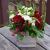 Red Roses blended with a variety of white flowers create the perfect