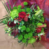 Wrapped to perfection is our Christmas Bouquet, full of christmas greens, and