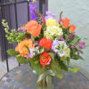 Brilliant festive blooms such as Free Spirit roses, snapdragons, larkspurs, hydrangea, in