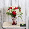 Warm their heart with a cozy arrangement of long-lasting white and red