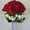 5 dozen Red Roses with orchid blooms 