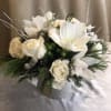 A decadent floral display of seasonal white and creme toned floral blossoms