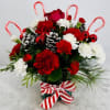This sweet arrangement of red and white, accented with candy canes. 