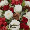 This Designers choice will feature winter greens and be arranged with seasonal