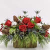 This centerpiece features, red roses, red berries and blue eryingium. This centerpiece