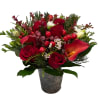 This Christmas centerpiece is a charming trio of festive elegance, consisting of