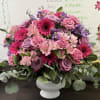 We arrange hot pinks, lavenders, light pinks, and an assortment of blooms