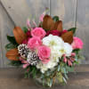 This seasonal and elegant arrangement has Hydrangea, Roses, Phalaenopsis Orchids, Veronica, Spray