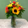 A spirited mixed arrangement showcasing vibrant shades of red, orange and yellow.