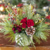 Christmas arrangement in a clay or ceramic vase. 