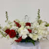 Red and white with a crystal angel. Flowers include roses, carnations, chrysanthemum