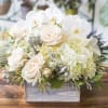 Pale palette of Roses, Hydrangeas and Orchids with an unusual twist from