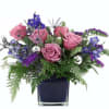 The Frosted Twilight Bouquet captures the magic of a winter evening with