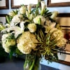 Elegance and purity come together in this breathtaking arrangement, featuring a large