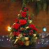 An adorable arrangement styled in the shape of a Christmas tree with