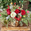 Christmas floral arrangement in a gold metal container