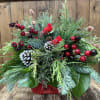 Embrace the enchantment of the holiday season with a breathtaking arrangement featuring