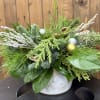 This enchanting holiday arrangement is a true celebration of the season, nestled
