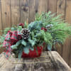 This stunning holiday arrangement is nestled inside a beautiful red and gold
