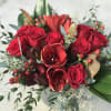 Freedom rose, red Amaryllis, wine Protea, burgundy Hypericum berries, Magnolia leaves and