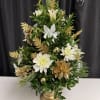 Elegant boxwood tree accented with gold and white accents. Long lasting!