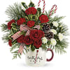 Red and white roses, with red carnations and pine cones. Topped off