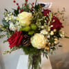 A Holiday Bouquet with white roses,  red accents, vibrant greens, red