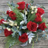 A dozen red roses, made for a side table or centerpiece. Accented