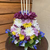 Adorable way to celebrate any occasion. Designer selected flowers. 6 Candles included.