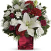 Filled with holiday charm. Red spray roses and white asiatic lilies are