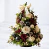The Tiny Tidings Tree is a charming tabletop holiday accent crafted with