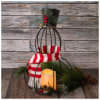 Add whimsical charm to your holiday d&eacute;cor with this metal snowman lantern.