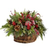 Bring in the holiday spirit with a basket filled with greens, berries