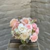 Soft and dreamy clouds of white hydrangea, roses, and astrantia in an
