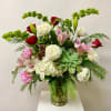 The Tall Arrangement Includes Christmas Greens, Pinecone Accents, a Succulent, White Hydrangea