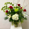 This Tall Arrangement Includes Christmas Greens, White Hydrangea, White Lily, Red Roses
