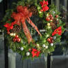 Christmas Wreath decorated in ornaments and ribbon. Approximately 28 inches in diameter.
