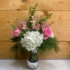 The Pretty in Pink Holiday Bouquet is a charming arrangement that combines