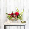 A modern holiday vase is created using roses, stars of bethlehem and