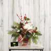 Evergreens, pinecones, mums and winterberry presented in a wooden square vase. A