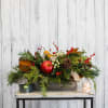 Send some warm comfort with this beautiful arrangement! Long lasting evergreens, faux