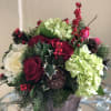 A  beautiful arrangement for Christmas with Hydrangeas, Roses, Kale, Tulips, Holly