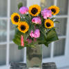 Arrangement measures approximately  22"H
Send a bouquet that radiates charm, smiles and