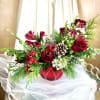 This fun holiday flower mix is arranged in a sparkly candy jar