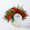 A festive floral arrangement that captures the spirit of the holidays. Bursting