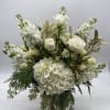This grande arrangement has the sentiment of the season, embraced in a