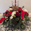 This elegant centerpiece will get everyone in the holiday spirit! Red roses